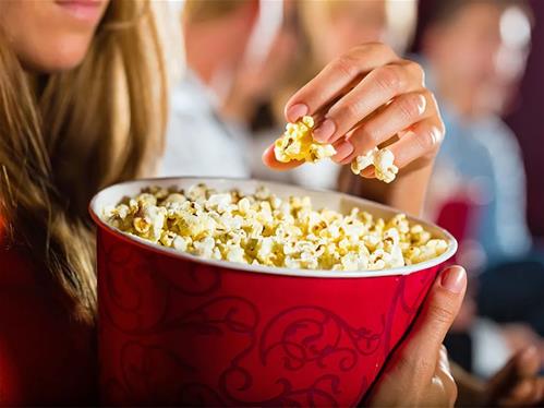 Woman-container-popcorn-cinema-movie-theater.jpg